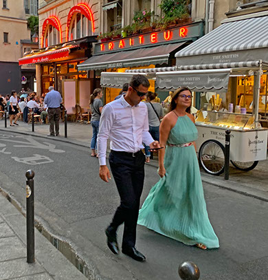 Couple walking along Rue de Buci.